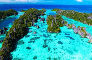 View of the small rocks and clear blue waters of Misool Island, Raja Ampat, image by ze_fir, shutterstock