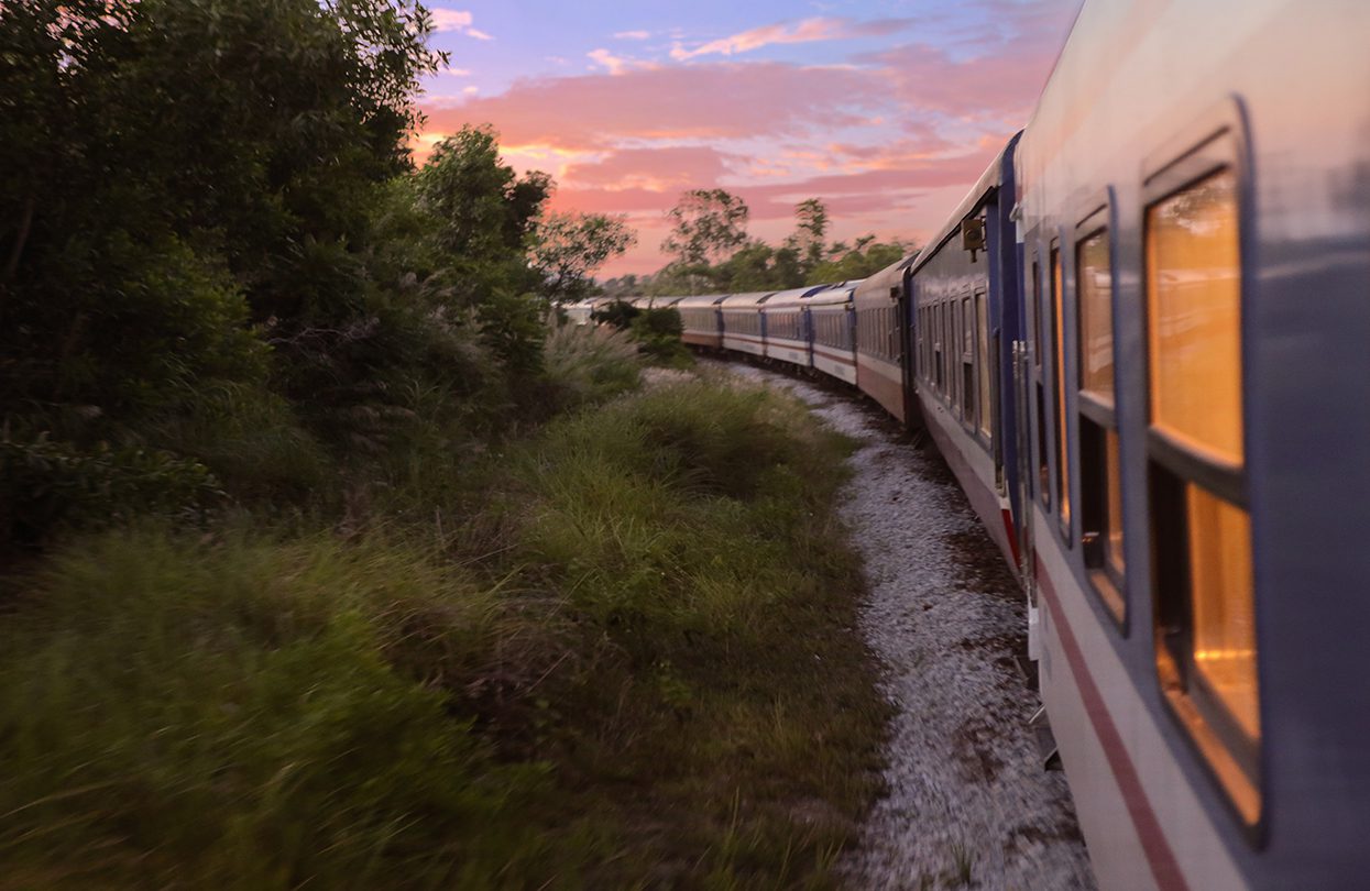 The Vietage exterior of the train as it rolls through the countryside